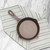 The Lancaster No. 4 Cast Iron Skillet on a kitchen towel on a marble counter