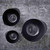 An overhead view of the Rosti Margrethe pebble black mixing bowls