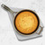 An overhead view of the Stargazer 12 Inch Cast Iron Skillet with cornbreead on a towel on a marble counter