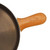 The Lancaster Cast Iron Skillet Handle Cover on the handle of a Lancaster Cast Iron Skillet