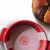 An overhead view of the King Arthur Baking silicone round loaf lifter in a Dutch oven