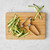 The Kitchen Basics Stainless Steel Vegetable Peeler with ribbons of zucchini