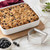 A Mrs. Anderson's Baking Pastry Blender next to a coffee cake with a streusel topping.