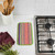A Wet-It! Skrubba XL Scratch-Free Scrub Pad on a kitchen counter next to a cooktop, ready for scrubbing.