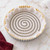 The Mrs. Anderson's Baking Pie Weight Chain on parchment paper on a tart crust ready for blind baking.