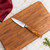 An overhead view of the Messermeister Oliva Elite 3.5 Inch Spear Point Paring Knife on a wooden cutting board.
