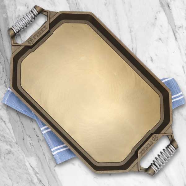 An overhead view of the FINEX 18 inch double burner griddle on a marble counter