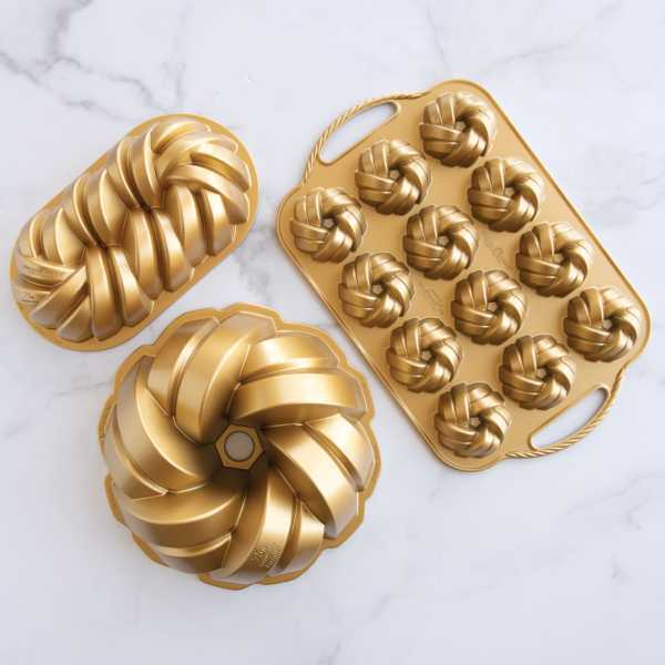 An overhead view of the Nordic Ware 75th Anniversary Cake Pans on a marble counter
