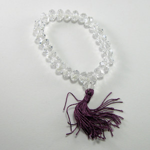 Stretch mala bracelet with purple tassle