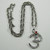 AUM Symbol Necklace with Red Crystal