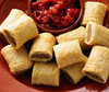 Patties Mini Party Sausage Rolls with sauce on a platter