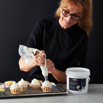 Queen Vanilla Buttercream Style White Icing Piping Onto Cupcakes