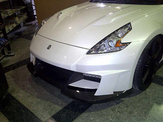AE105-01C VeilSide 2009-2023 Nissan 370Z Fairlady Z Z34 Ver. 1 FRP Front Bumper with Carbon Accent