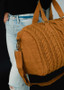 Mustard cable knit duffel bag