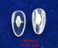 NP463  Soft Silicone Crimp-On nose pad 16mm length in Tear-drop shape made from soft Silicone with silver color metal insert.  The mount has two flat bars that can be bent to secure pad to nose pad arm.  This style of nose pad has and is still used extensively used on B & L Ray Ban frames.   Packaged in 5 pair bags
