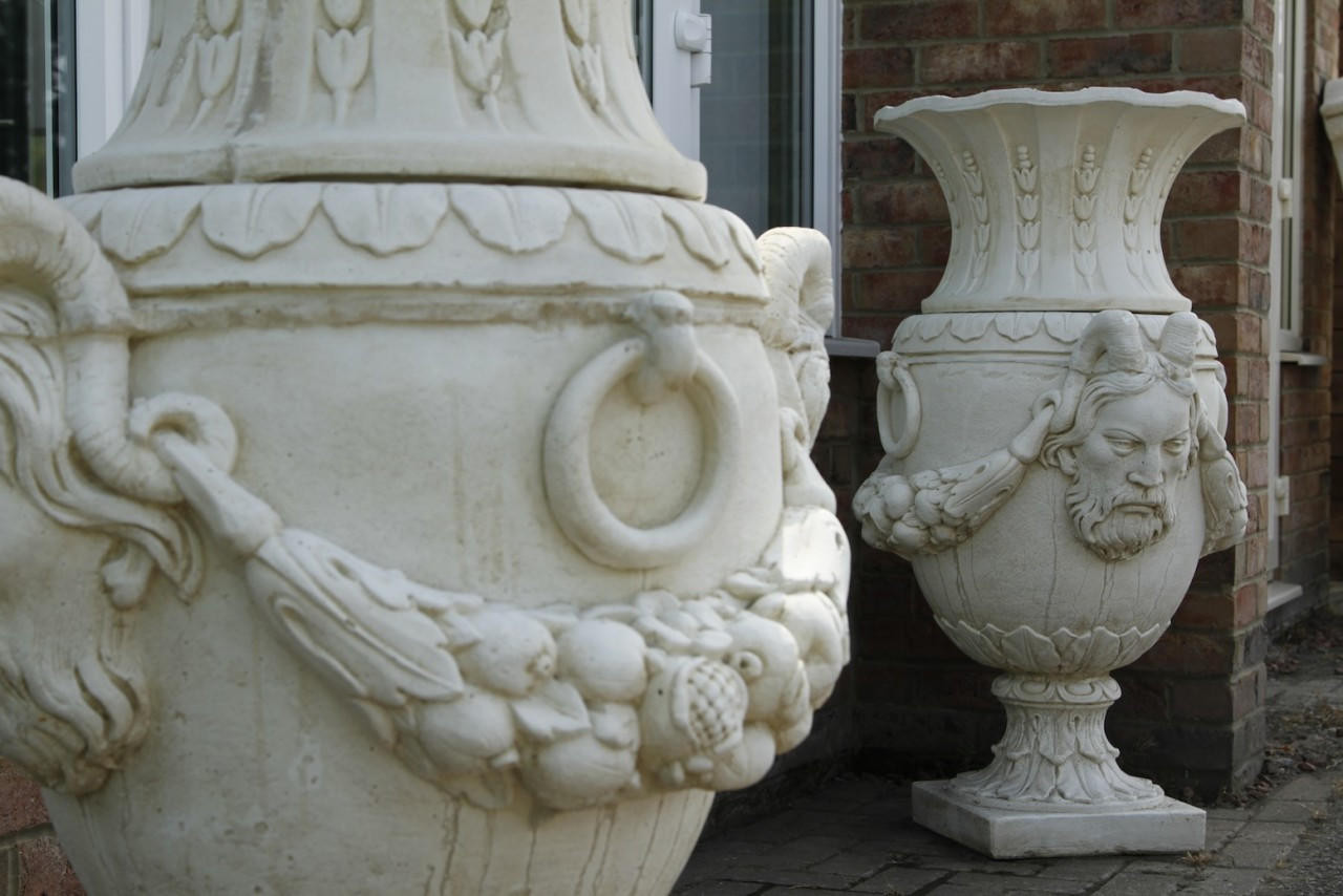 Pair of Urns With Mythical Horned Man Design 