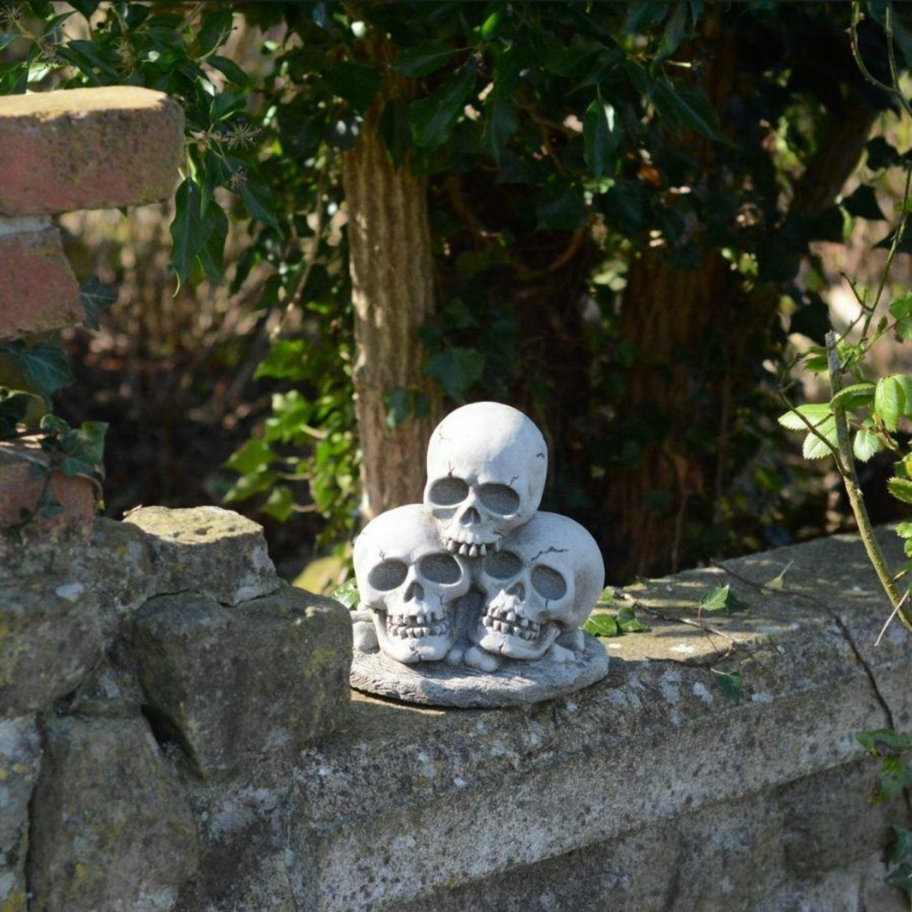 Three Skull Stone cast Garden Ornament