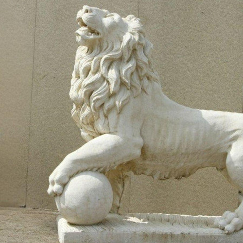 Very Large Stunning Lion's sculpture on a ball facing left 