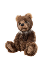 A highly realistic brown plush teddy bear with detailed facial features, wearing a small necklace, sits upright against a plain white background.