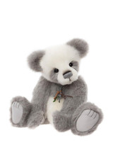 A grey and white panda-style Charlie Bear teddy sits upright against a white background, featuring large paws, black bead eyes, and a small decorative tassel charm on its chest.
