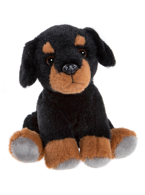 A Rottweiler-style stuffed teddy bear sits upright against a white background, featuring black and tan plush fur, floppy ears, brown eyes, and grey-tipped paws.