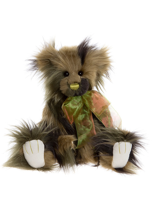 A shaggy, dark olive and brown Charlie Bear teddy sits upright, wearing a green and copper iridescent ribbon bow, with white paw pads, against a white background.