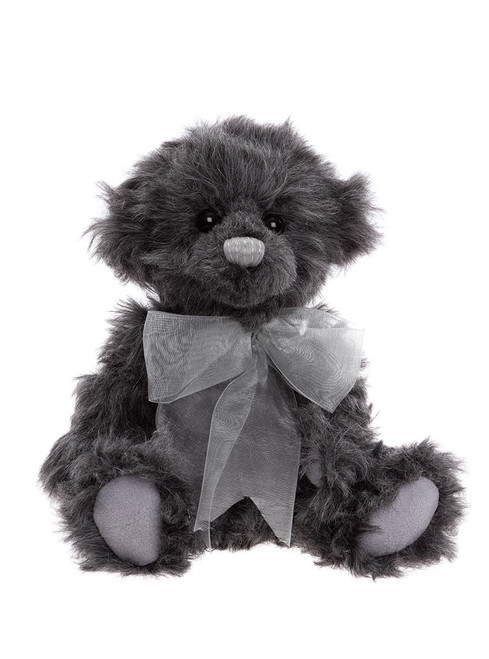 A dark charcoal grey, fluffy Charlie Bears teddy bear sits upright against a white background, wearing a sheer silver-grey organza bow ribbon around its neck.