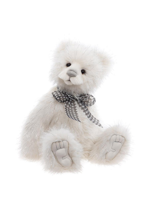A white fluffy Charlie Bears teddy bear sits upright, wearing a grey gingham bow tie. It has silver-tipped fur, a grey velvet nose, and detailed paw pads.