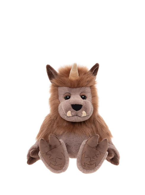 A brown plush stuffed monster toy with a single horn, pointed ears, tusks, and clawed feet, sitting upright against a white background.