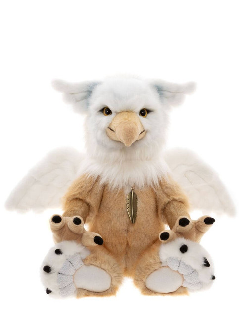 A griffin-style Charlie Bear plush toy sits upright against a white background, featuring white and tan fur, eagle beak, wings, clawed feet, and a gold feather charm pendant.