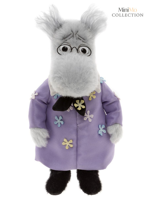 A grey plush bear stands upright wearing a purple floral coat, black bow tie, and round glasses, with wild grey hair, against a white background.