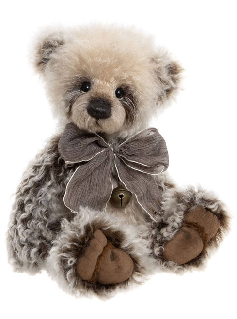 A fluffy grey and cream Charlie Bears teddy bear sits upright, wearing a grey ribbon bow with a small bell pendant, against a white background.