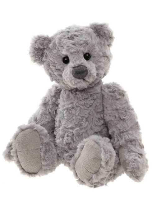 A grey, fluffy Charlie Bears teddy bear sits upright against a white background, featuring curly textured fur, black button eyes, and lighter grey paw pads.