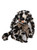 A plush rabbit toy with leopard-print black, cream, and tan fur sits upright, featuring floppy ears, a copper nose, and a shimmery gold bow tie.