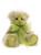 A green and cream plush Charlie Bears teddy bear sits upright, adorned with a sheer lime green ribbon bow tied at its neck, against a white background.