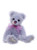 A lavender-blue mohair Charlie Bear sits upright against a white background, wearing a sheer pink ribbon bow at its neck, with cream suede paw pads and a pink embroidered nose.