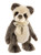 A panda-style Charlie Bear stands upright against a white background, wearing a cream organza bow with a small antique brass key charm pendant.