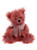 A deep rose/raspberry-coloured fluffy Charlie Bear teddy bear sits upright against a white background, wearing a sheer pink organza ribbon bow at its neck.