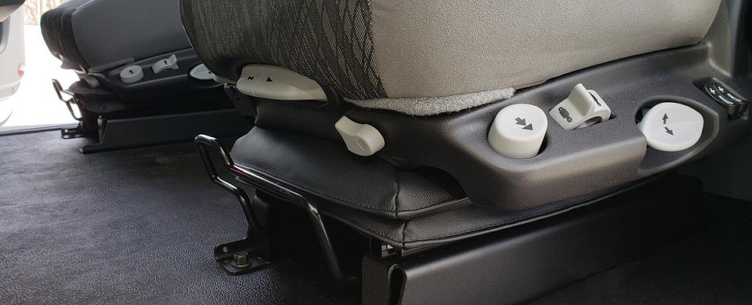 Semi-truck Seat Adjustment Controls and Suspension Base Close-up