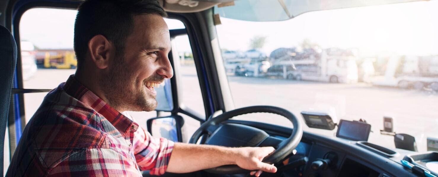 Semi-truck driver in the cab of a Peterbilt 389 Seat