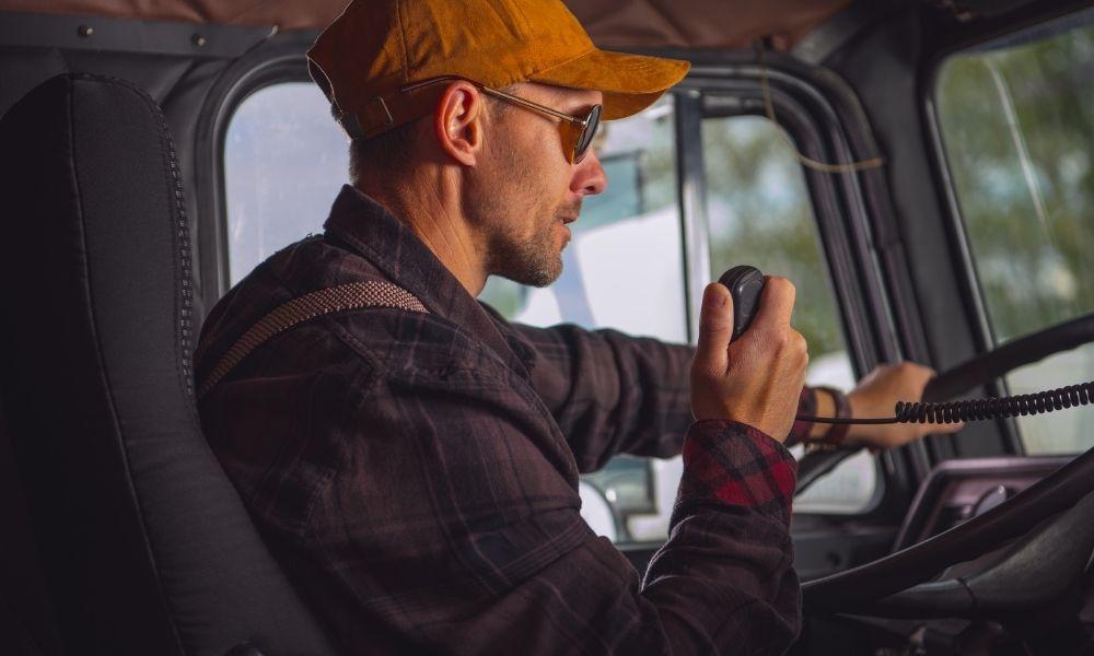 Trucker Sitting in a Semi-Truck Seat that Needs Replaced