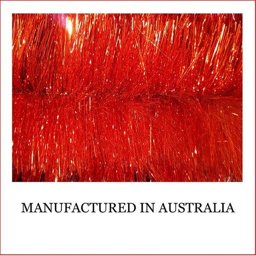 Australian manufactured 4 Ply Tinsel Garland - Red (100mm x 5.5m). Very thick and lush commercial grade tinsel made right in Australia. We cannot emphasize how beautiful this tinsel looks. Currently in very high demand for corporate clients from shopping centres, RSL's, car yards and various businesses from fruit shops to offices and building foyers. Made in Australia from quality raw materials that strengthen the garland tinsel which ensures a longer lasting product. Colours Also Available : Black, Cerise, Electric Blue, Gold, Green, Lime, Orange, Purple, Red, Royal Blue, Silver, White