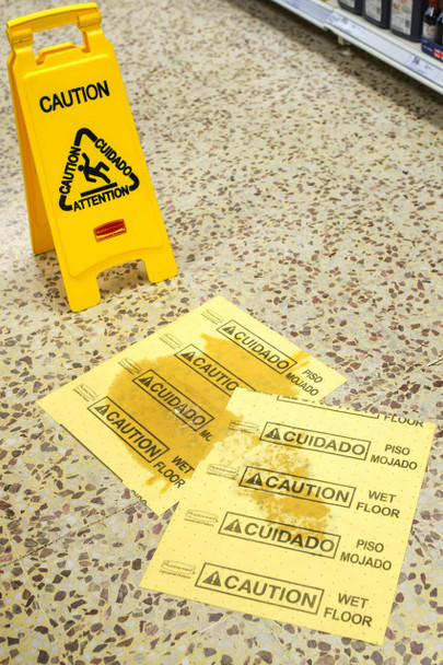 FG425200YEL - Rubbermaid Over-the-Spill Pad Refill for Over-the-Spill Stations - Placed on Spill