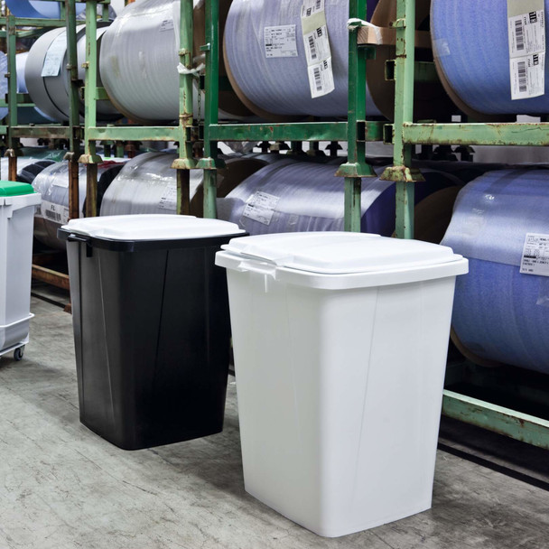 White Durabin 90 Placed Next to Black Durabin 90, Both Fitted with White Lids and Positioned Alongside Reels of Banding