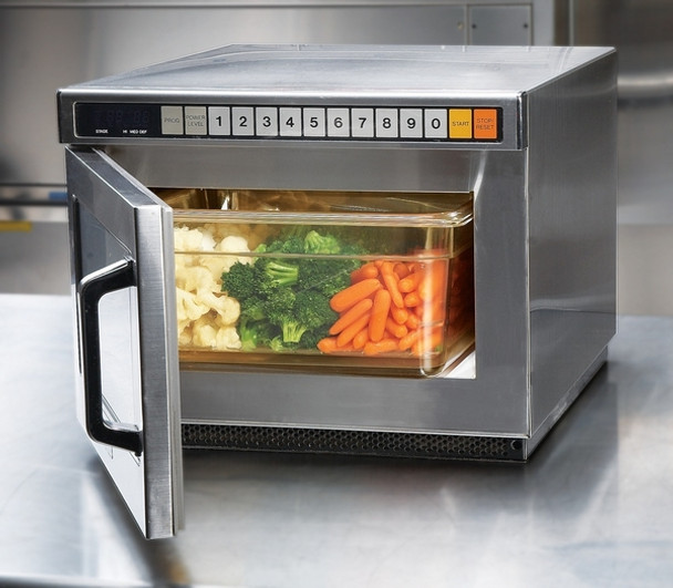 24HP150 - A plastic, rectangular food pan with amber colouration containing carrots, broccoli and cauliflower inside oven