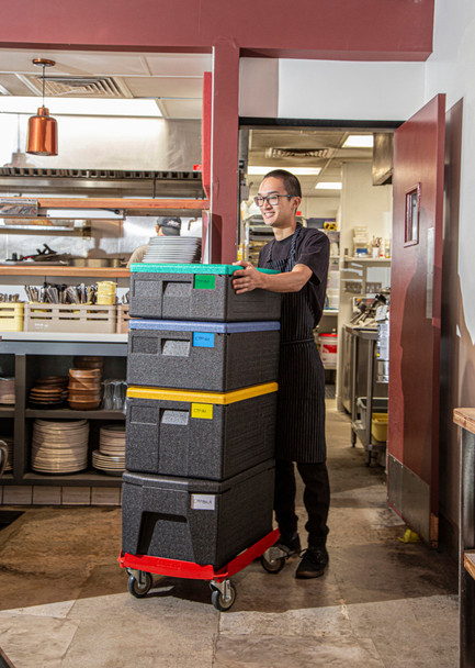 EPPID5 - A kitchen worker with 4 goboxes fitted with white, yellow, blue and green labels and stacked on a cam dolly