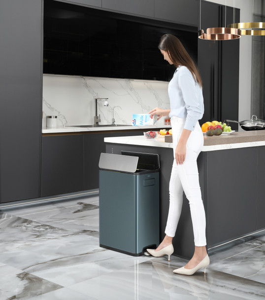 EK9377TB2020 - EKO Ecofly Slimline Dual Stream Recycling Pedal Bin - 40 Ltr - Titanium Blue - At End of Kitchen Island & Being Used By A Lady to Discard of Old Milk Carton