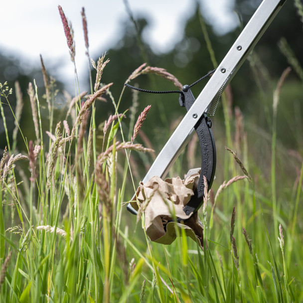 Close-Up of Community Litter Picker Being Used to Collect Litter from Long Grass