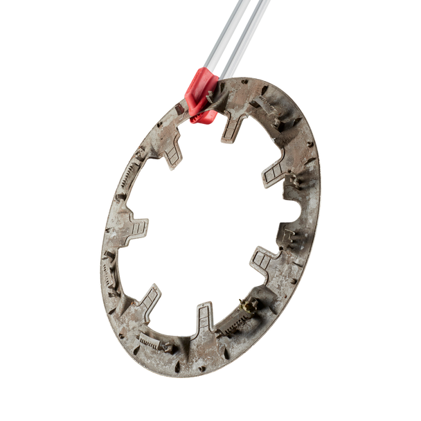 Wheel Trim Held Between Red Rubber Grips