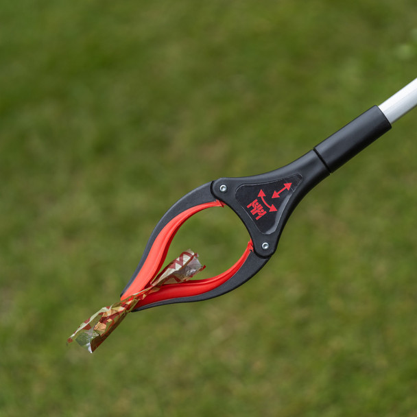 Close-Up of Rotating Gripping Jaw Holding a Piece of Plastic Film